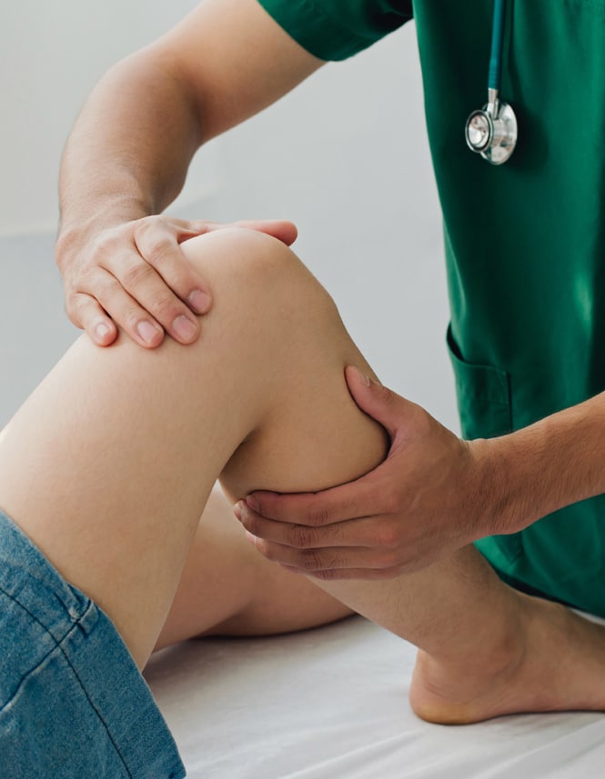doctor hands on patient knee